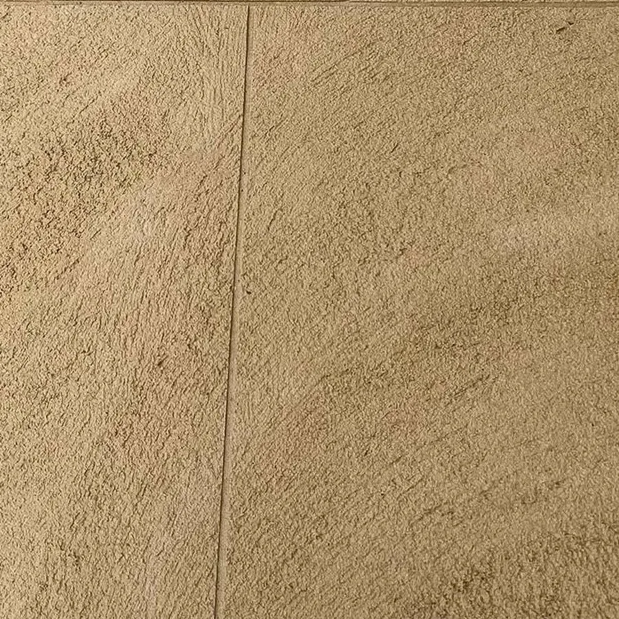 Close view of honey-toned liquid limestone with a brushed swirl texture and a fine saw-cut joint, no stones visible